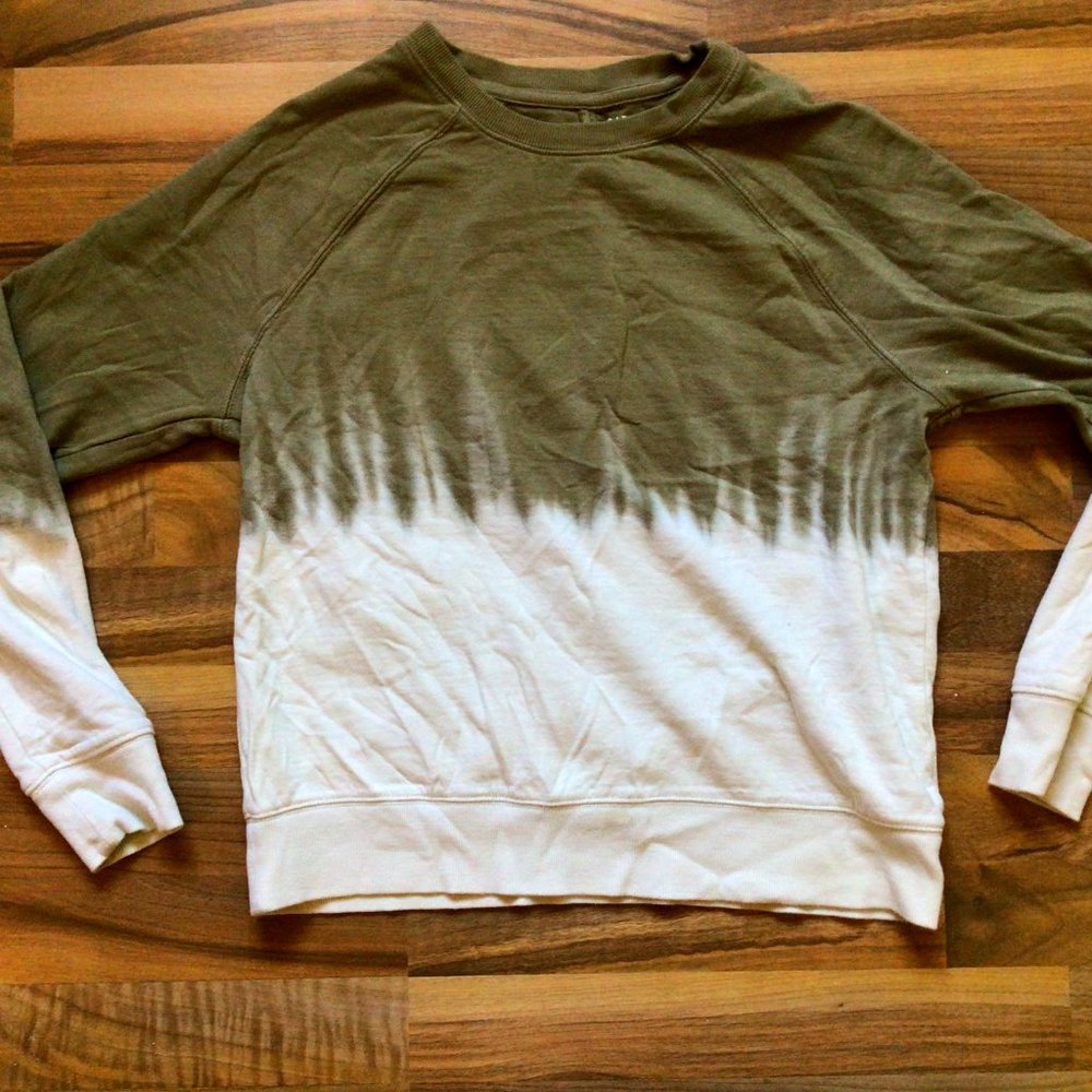 green melting sweater